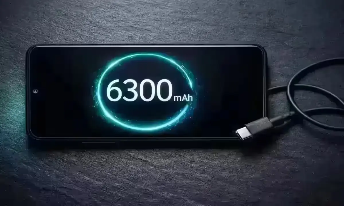 Redmi 15A 5G battery screen showing 6300mAh capacity with a USB-C cable placed nearby on a dark surface