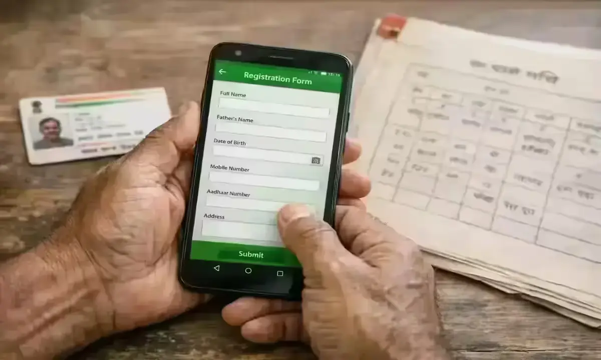 Farmer completing pmfby.gov.in registration with Aadhaar card and land records on table, PMFBY Scheme 2026